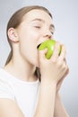 Caucasian Teenager Girl Eating Green Apple Royalty Free Stock Photo