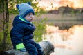 Cute toddle boy outdoors near lake