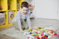 Child playing with colorful toy blocks Royalty Free Stock Photo