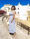 Caucasian tourist woman enjoying the Roman Theatre of Cadiz, Spain