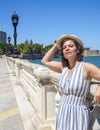 A woman posing on the Alameda Apodaca promenade, Cadiz, Spain