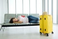 Caucasian traveler woman is sleeping on passenger While waiting to travel by plane in airport. Ã Â¹â¹Jouney and travel for business