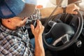 Caucasian Trucker Providing Conversation Using CB Radio Inside His Truck Royalty Free Stock Photo