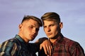 Caucasian twins in shirts with serious faces