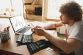 Caucasian upset and despair man watching financial and economical graphs going down during coronavirus quarantine Royalty Free Stock Photo