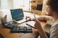 Caucasian upset and despair man watching financial and economical graphs going down during coronavirus quarantine Royalty Free Stock Photo