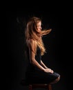 Caucasian white female model portrait. The wind blowing the long blonde hair off on beautiful girl. Royalty Free Stock Photo