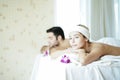 Caucasian White women and men lying in spa massage parlors. Happy Couple On Massage Therapy Relaxing In Spa center Royalty Free Stock Photo