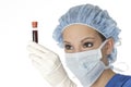 Beautiful woman laboratory technician examining a tube of blood