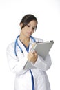 Beautiful Caucasian woman doctor or nurse writing on the pad Royalty Free Stock Photo