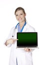 Caucasian doctor holding a laptop computer and pointing at screen