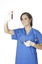 Beautiful woman laboratory technician examining a tube of blood