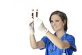 Beautiful woman laboratory technician examining a tube of blood