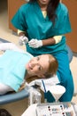 Caucasian woman and African-American dentist