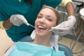 Caucasian woman and African-American dentist