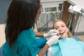 Caucasian woman and African-American dentist