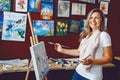 Caucasian woman artist drawing painting in art studio Royalty Free Stock Photo