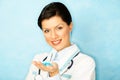 Caucasian woman as a doctor holding meds Royalty Free Stock Photo