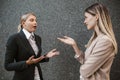 Woman assistant talking and discussing work to businesswoman