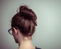 Caucasian woman from behind with brown hair in a ponytail