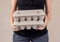 Caucasian woman with black shirt holding two cardboard egg boxes full of chicken eggs Royalty Free Stock Photo