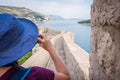 Woman in blue hat on the walls of Dubrovnik Royalty Free Stock Photo