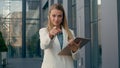 Caucasian woman businesswoman business lady professional hr manager employer outdoors pointing finger at camera choosing Royalty Free Stock Photo