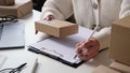 Woman Doing Storage Office Revision And Parcels Inventory