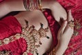 Caucasian woman dressed in Indian bridal Sari along with specific jewelry