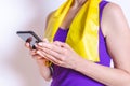 Caucasian woman dressing purple sport clothes checking her phone Royalty Free Stock Photo