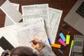 A caucasian woman is filling 1040 federal income tax return forms Royalty Free Stock Photo