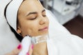 Caucasian woman getting face peeling procedure in a beauty clinic Royalty Free Stock Photo