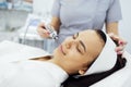Caucasian woman getting face peeling procedure in a beauty clinic Royalty Free Stock Photo