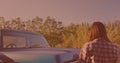 Caucasian woman getting out of the car and opening the hood on the street Royalty Free Stock Photo