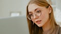 Caucasian woman in glasses girl lady student businesswoman freelancer female with laptop at home office working online Royalty Free Stock Photo