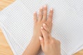 Caucasian woman with hand on her unhealthy finger and palm. Self massage, office syndrome and musclar pain. one female hand