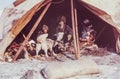 Caucasian woman having conversation with family of the indigenous people