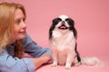 Caucasian woman and her puppy japanese chin.