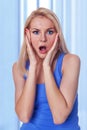 Caucasian woman holding her face in astonishment Royalty Free Stock Photo