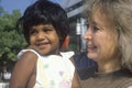 A Caucasian woman holding an Indian child, Chevy Chase, MD