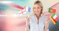 Caucasian woman holding multiple flags against digital waves on pink background with copy space