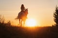 Caucasian woman and horse training during sunset Royalty Free Stock Photo