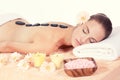 Caucasian woman hot stone massage wellness