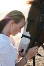 Caucasian woman hugging horse slow motion. Love and friendship concept. Royalty Free Stock Photo