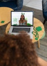 Caucasian woman on laptop screen blowing kiss making st patrick\'s day video call to friend