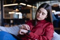 Caucasian woman looking at her digital watch Royalty Free Stock Photo