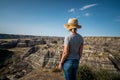 Female Traveler Looking at View at Horseshoe Canyon Near Drumheller in Alberta, Canada
