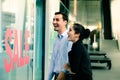 Caucasian woman and man excited when see the price tag on sale at the store Royalty Free Stock Photo