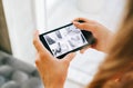 Caucasian woman monitoring security cameras on smartphone indoors, closeup Royalty Free Stock Photo