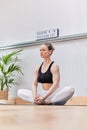 Caucasian woman performing meditations and breaths of yoga or pilates